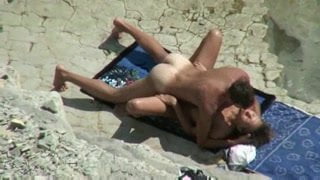 Couple spyed on a beach