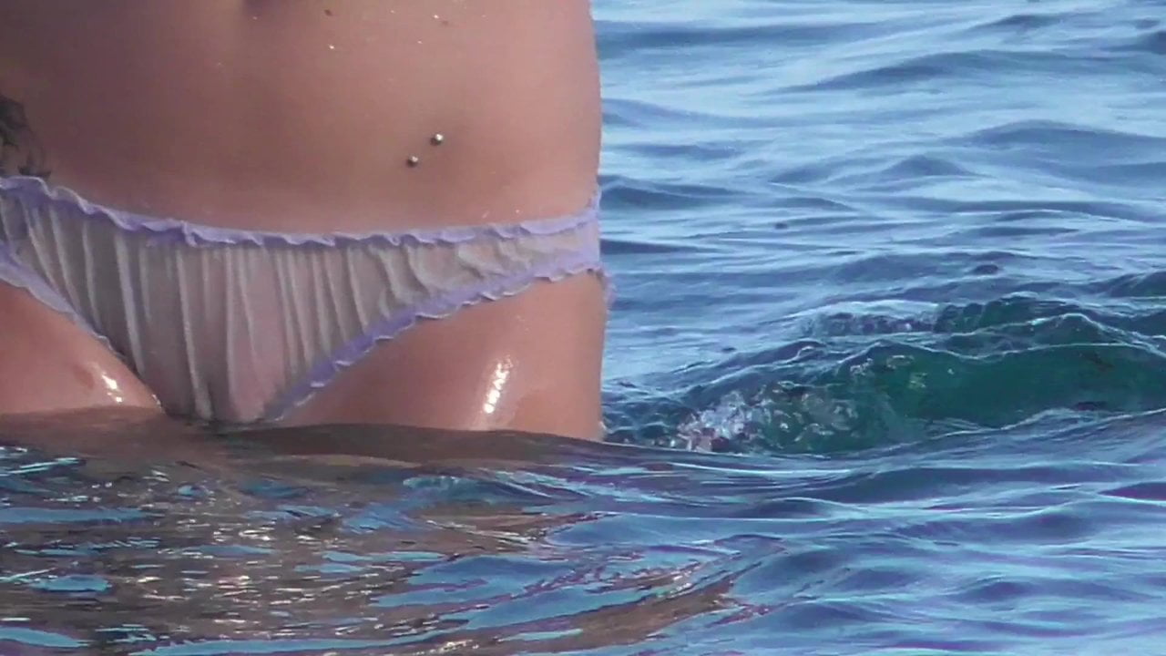 Beach girl goes for swimming in panties - watch out