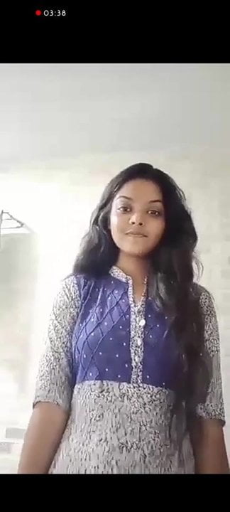 Beautiful Indian girl striping in bathroom