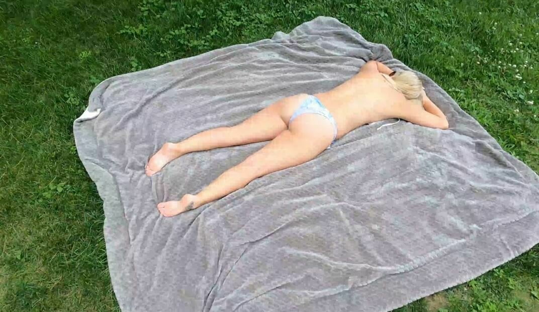 Flasher pulls his cock out for nude teen sunbather in park