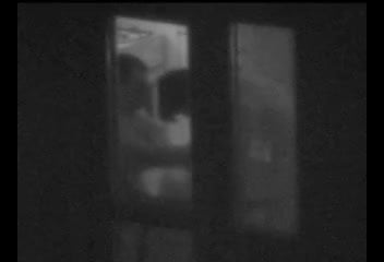 Couple caught through a window on spy cam