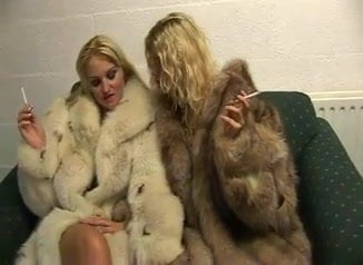 Two blondes girl in fur coat