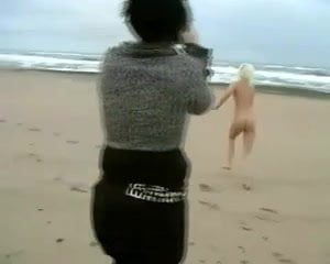 Daring Blond Bares All on a Cold Beach