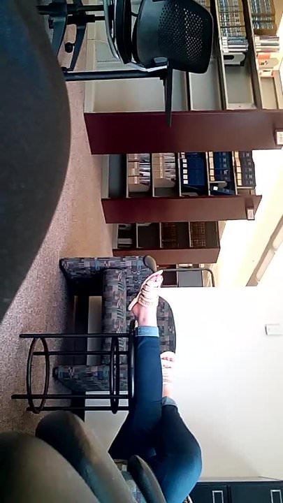 LONGER CLIP OF COLLEGE GIRL IN LIBRARY