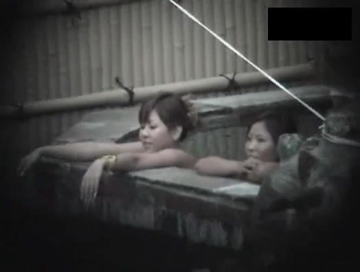 2 asian japanese ladies relax in outdoor public bath